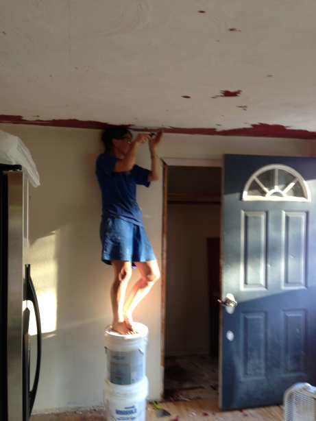 mom peeling the red off the ceiling